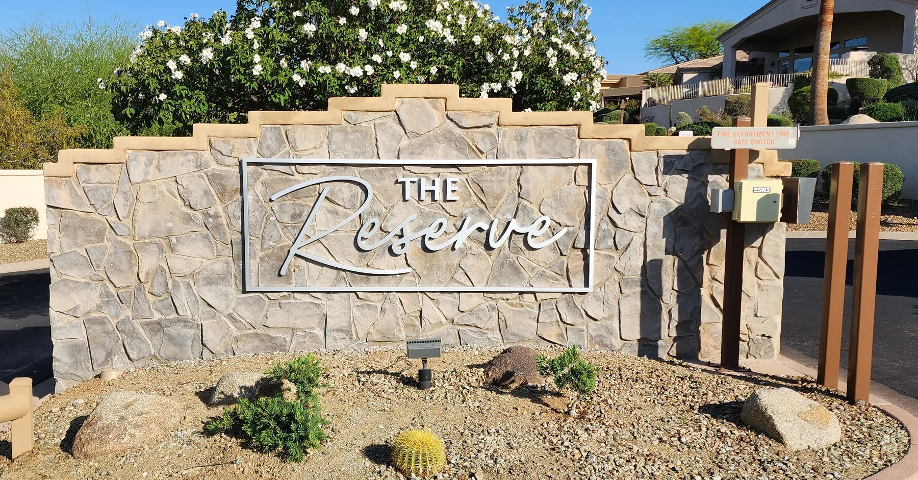 The Reserve stone entrance monument with dimensional letters