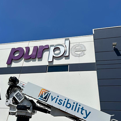 Surface preparation and structural setup before commercial sign installation